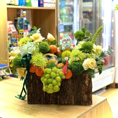 Imported fruit basket designed with a mix of fresh flowers in green tone GTC08