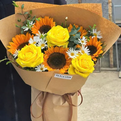 A bouquet of sunflowers blocks the new road HB303
